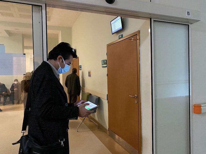 Medical Sales Representative working in hospital corridor